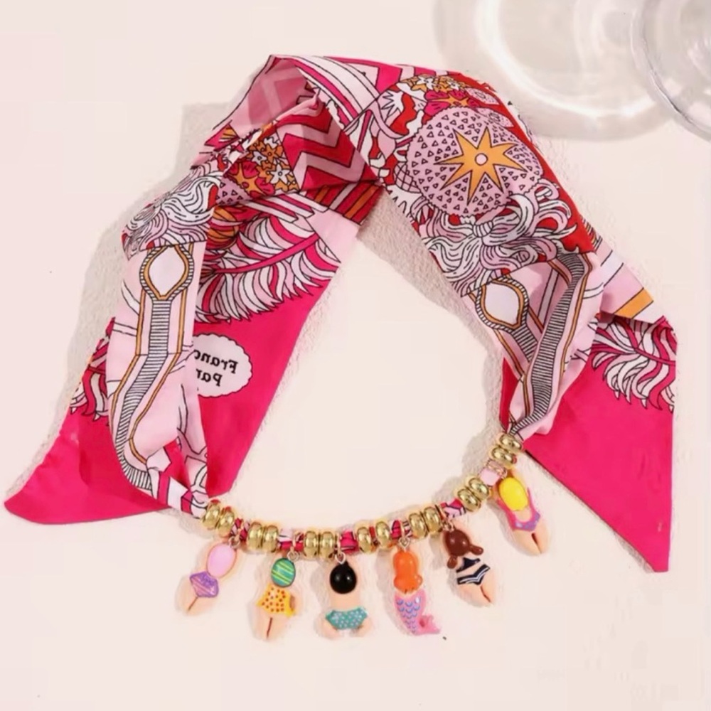 Anthropologie Gold Beaded Necklace with Colorful Swimmer Charms - Picture 3 of 3